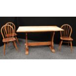 An oak farmhouse refectory type trestle style dining table,