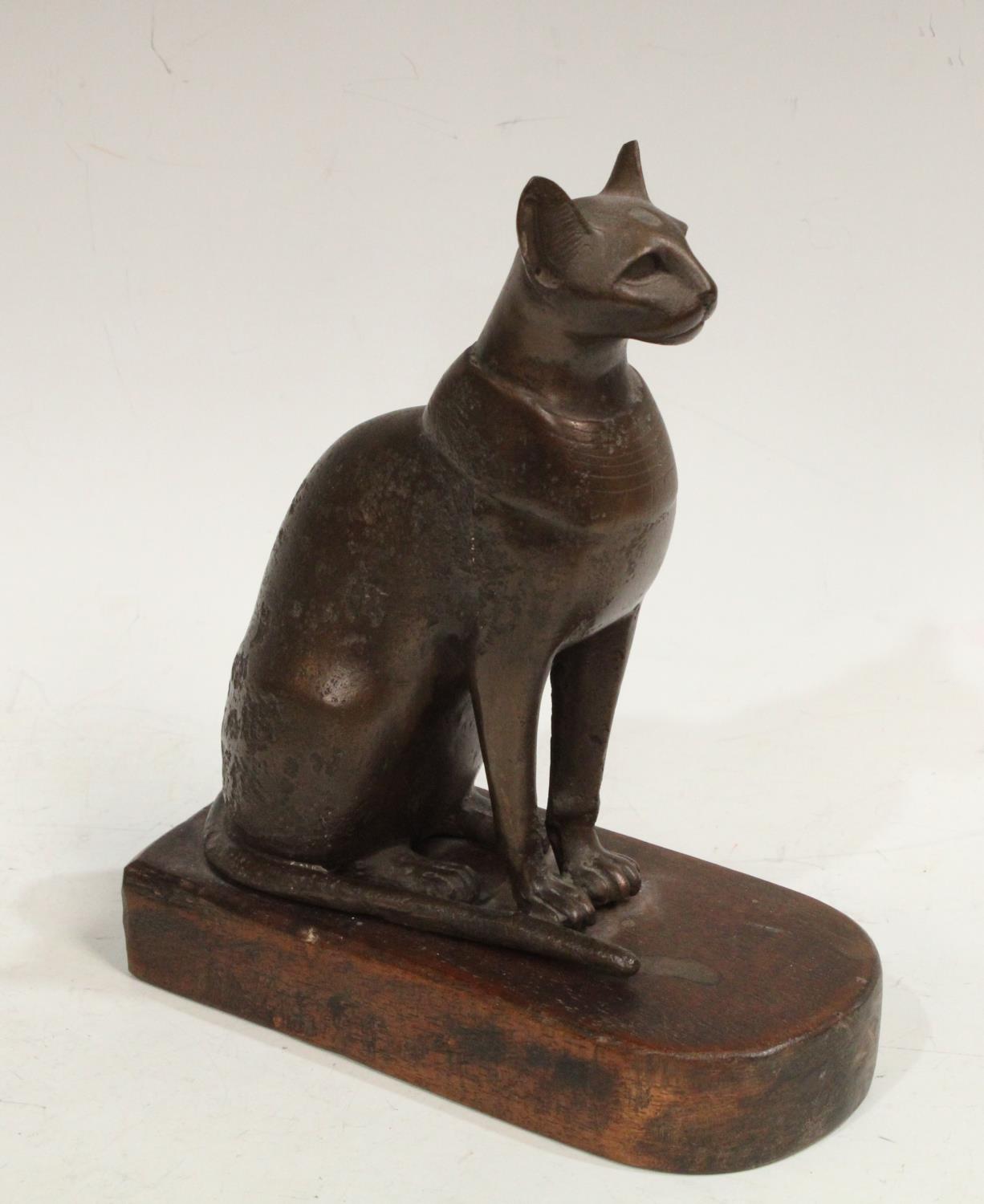 ***Please note amended description***A bronzed composite Egyptian cat desk weight, wooden base,