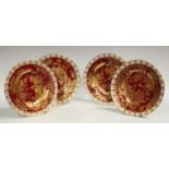 A set of four Royal Crown Derby Red and Gold Aves shaped circular dessert plates, heraldic borders,
