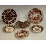 A Royal Crown Derby Imari 1128 pattern teacup and saucer, seconds; an 1128 tea plate,