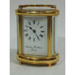 A Charles Frodsham London oval cased carriage clock, curved bevelled glass, Roman numerals,