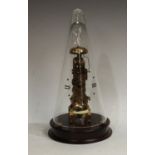 A Franz Hemle brass skeleton clock, conical glass dome, key printed with Roman numerals, pendulum,