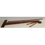 A 19th century T-square; a boxwood yard stick; a boxwood rule;