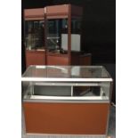 A suite of polished aluminium and brown painted shop fitting display cabinets,