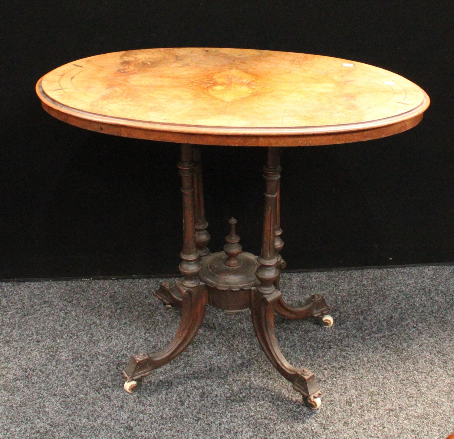A Victorian walnut and marquetry oval centre table, 90.