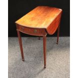 A George III mahogany Pembroke table, elliptical top with fall leaves above a single frieze drawer,