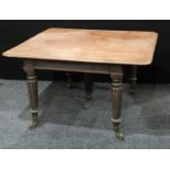 A George IV mahogany rounded rectangular extending dining table, moulded top, fluted legs,