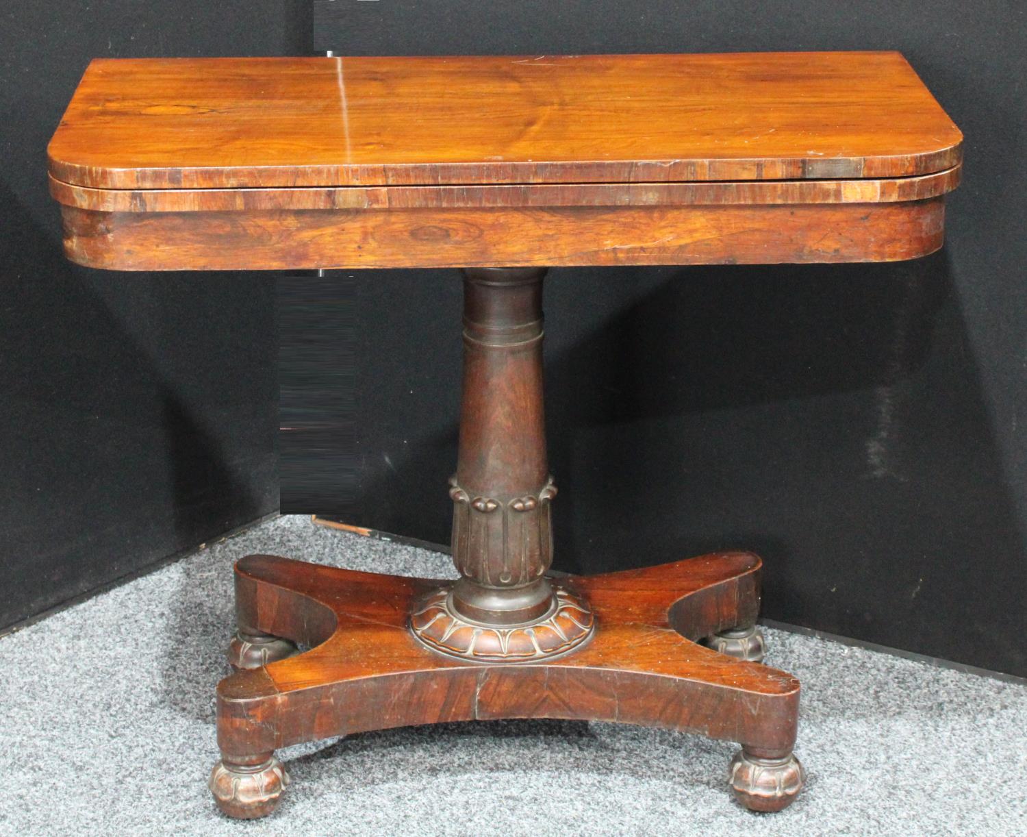 A William IV rosewood card table, hinged top enclosing an inset baize lined playing surface,