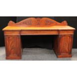 A Victorian mahogany slightly inverted break-centre twin pedestal sideboard,