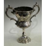 A 19th century Anglo-Indian silver inverted ogee pedestal military presentation cup,