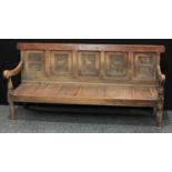 An 18th century oak settle,