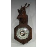 A Black Forest wall hanging aneroid barometer,