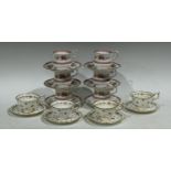 A set of four Coalport teacups and saucers, printed and painted with rosebuds,