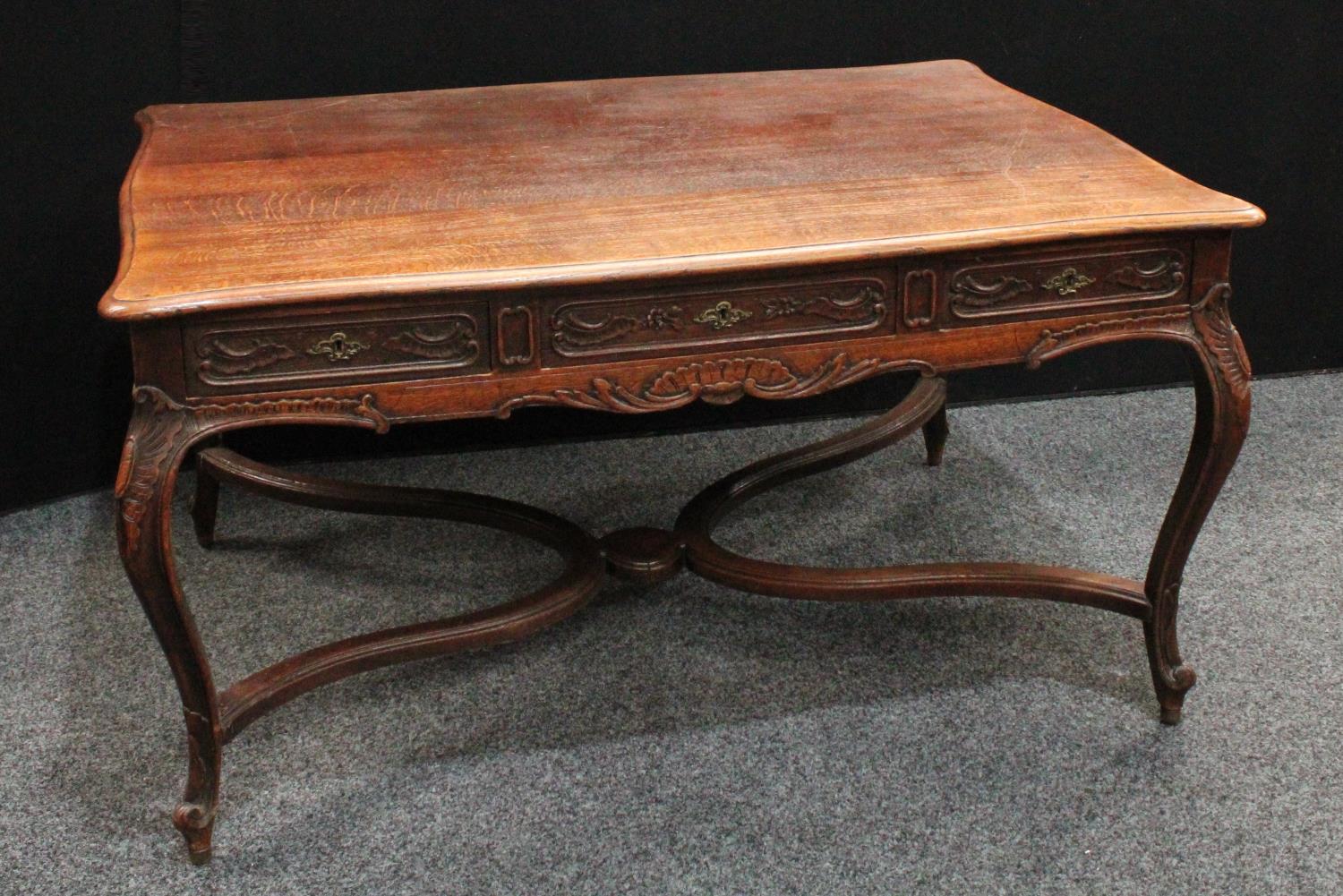 A Louis XV Revival library table, in the French Provincial taste,