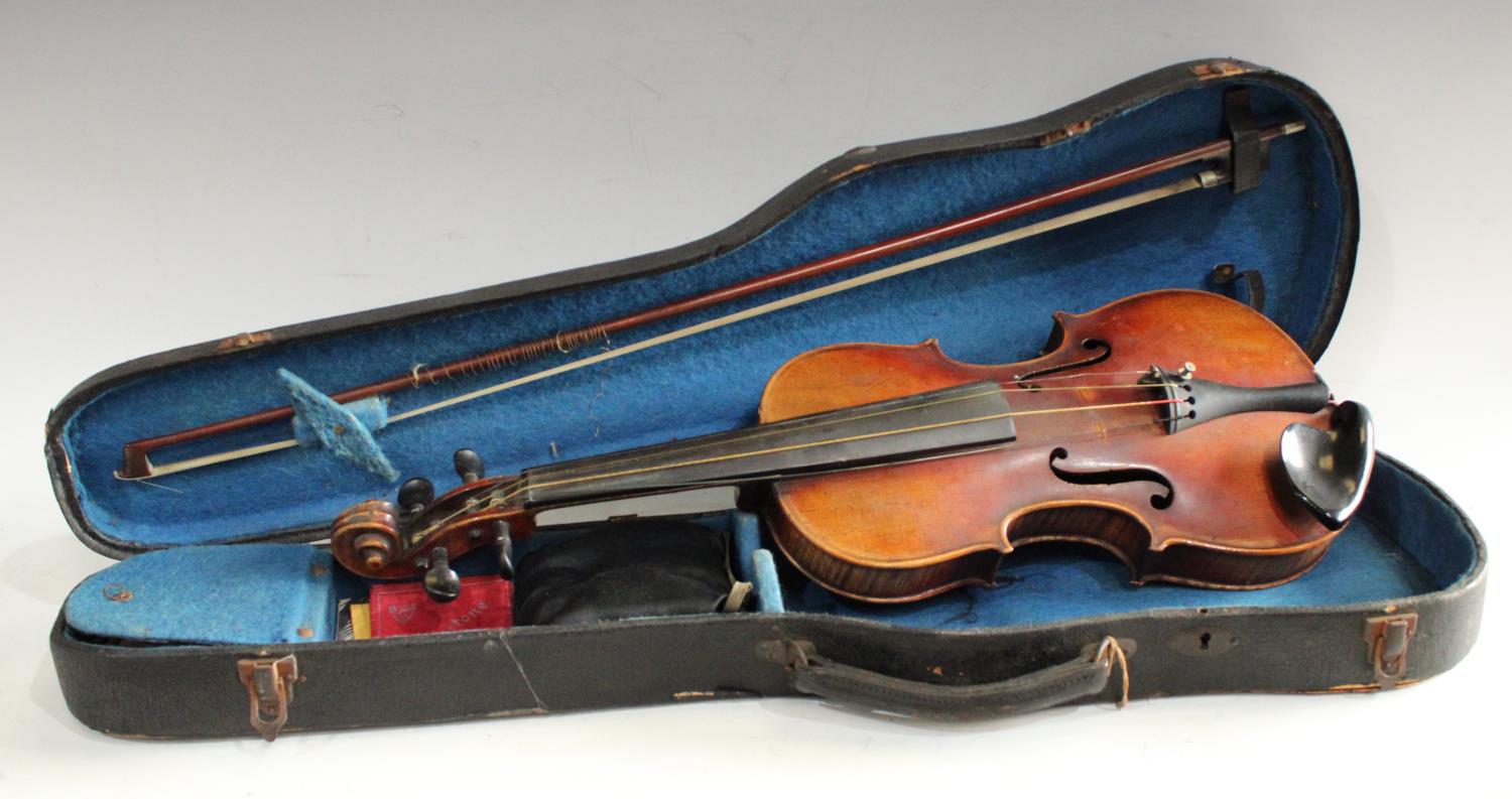 A late 19th/ early 20th century Stradivarius copy violin, two piece back, double line purfling,