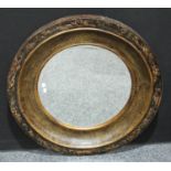 A large Eastern style circular wall mirror, decorative frame, bevelled glass,