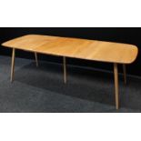 An Ercol elm extending dining table, rounded rectangular top with additional hinged leaf,