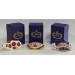 A Royal Crown Derby paperweight, Crab, gold stopper, boxed; others, Snail, gold stopper, boxed; Pig,