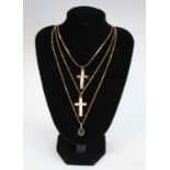 A 9ct gold necklace, the pendant set with a blue stone, 2.8g; two 9ct gold cross necklaces, 5.