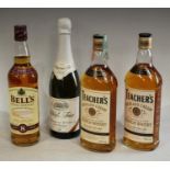 A bottle of Teacher's Highland Cream whisky, 75cl; another; a bottle of Bell's Scotch whisky,
