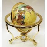 A gemstone globe, cream ground.