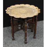 A Persian style brass top folding table