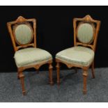 A pair of Sheraton Revival walnut boudoir chairs,