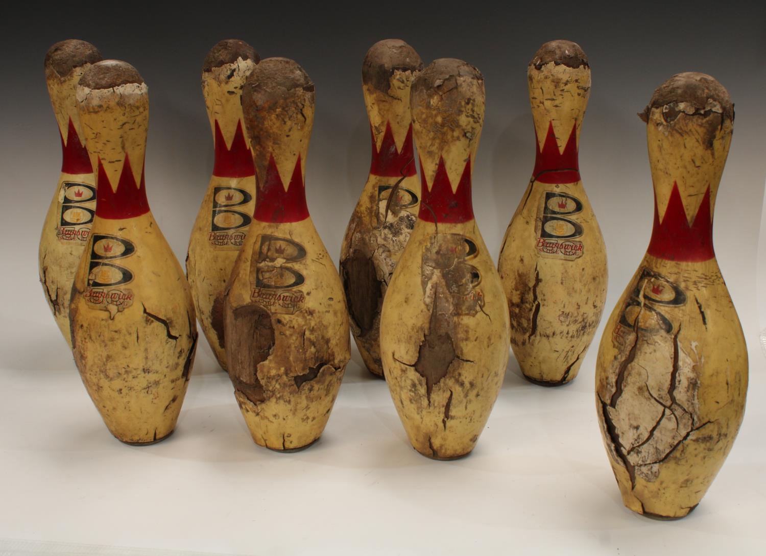 A set of eight vintage hardwood Brunswick bowling pins, 50 Score King, Nylon reinforced,