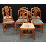 A set of five Hepplewhite design oak dining side chairs; another two,