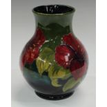 A Moorcroft Hibiscus pattern vase, signed Walter Moorcroft,