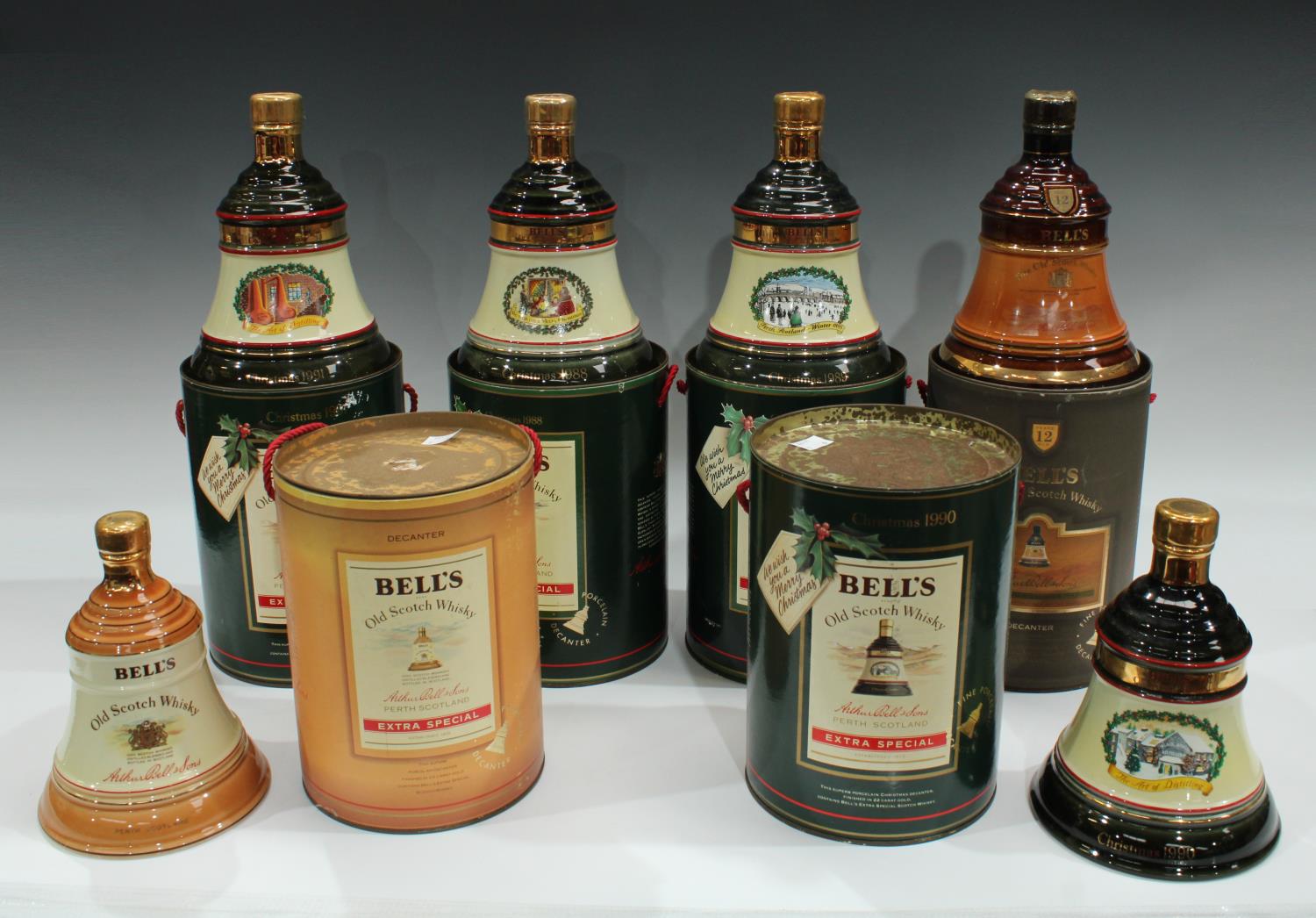A Bell's Scotch Whisky bell shaped decanter, cylindrical box, 1988, others similar 1989,