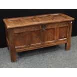 A 17th century oak blanket chest, hinged top enclosing a till,