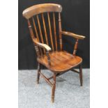 A farmhouse beech and elm open armchair,