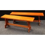 A pair of retro mid-20th century benches, Reynolds of Ludlow, the largest 137cm,