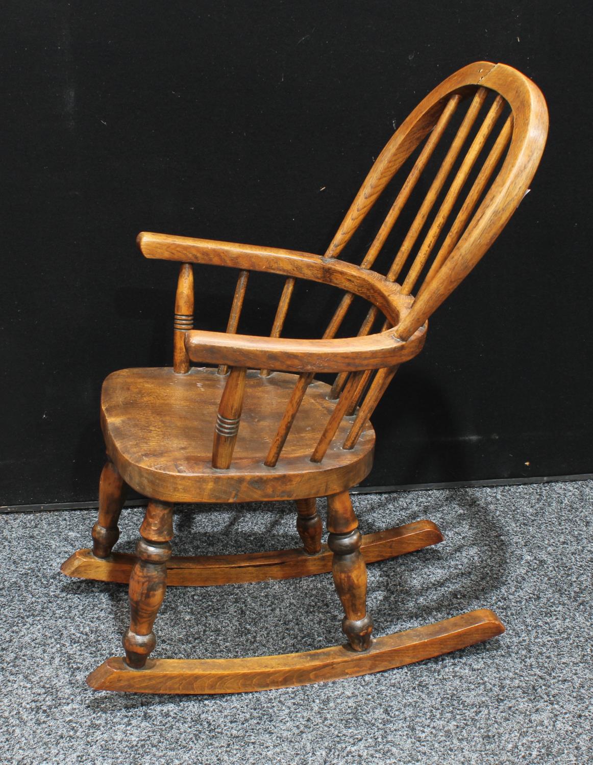 A Country House child's Windsor rocking chair, hoop back, bowed mid-rail, saddle seat, - Image 4 of 4