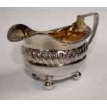 A George III silver cream jug, acanthus capped angular handle, gilded interior, 9cm high,
