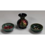 A Moorcroft Leaf and Berries pattern miniature compressed baluster vase, 9cm,