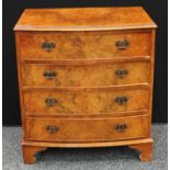 A George III style walnut bow-front chest,