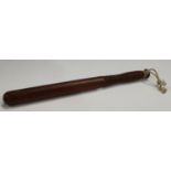 A turned mahogany truncheon,