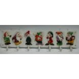 A novelty cast iron Seven Dwarves coat rack,