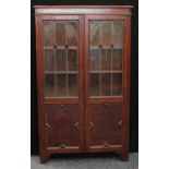 An early 20th century oak leaded glazed bookcase, c.