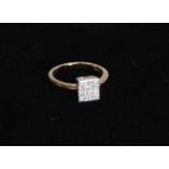 An 18ct gold ring, set with diamonds in square setting, diamond weight .