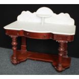 A Victorian mahogany bow-centre washstand,