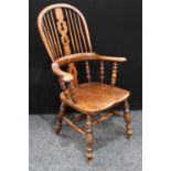 A Country House elm Windsor elbow chair, hoop back, pierced splat,