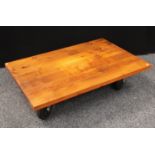 An oak 'roller' coffee table, 120cm long,