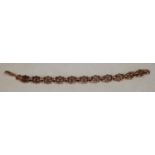 A fancy link rose gold coloured metal bracelet, unmarked,(tests as 9ct gold) 20.5cm long, 19.