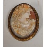 A 19th century carved shell bacchante cameo brooch, yellow gilt metal mount, safety chain ,