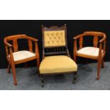 A pair of Edwardian design mahogany open tub chairs;