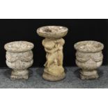 A pair of stone campana shaped garden urns, 32.