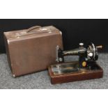 An early 20th century Singer hand crank sewing machine,